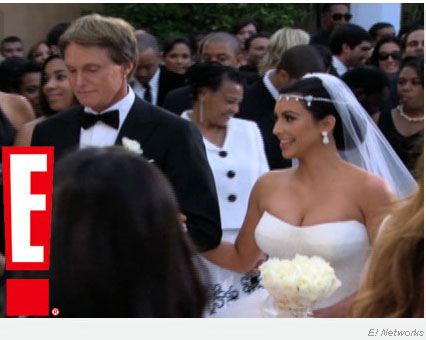 The groom looked dapper in a white tuxedo jacket white shirt white bow tie 