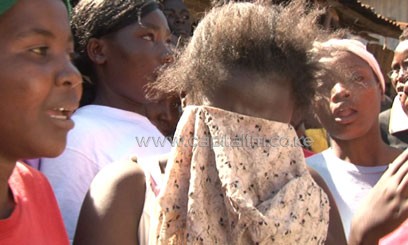 Neighbours at the scene where five children were found murdered in their house in Korogocho, Nairobi. PHOTO:File