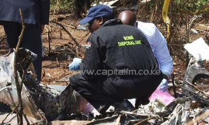 Experts inspecting a blast site/FILE