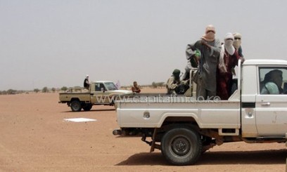 Fighters of the Islamic group Ansar Dine standing in pick-up trucks in Kidal/AFP