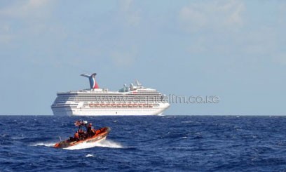 A Coast Guard boat patrols near cruise ship Carnival Triumph in the Gulf of Mexico on February 11/AFP