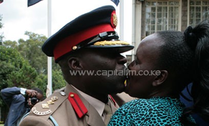 One of the officers who graduated gets congratulated/CFM