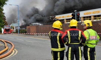 Firefighters at the scene of a huge fire at a recycling plant in Smethwick near Birmingham on July 1, 2013/AFP