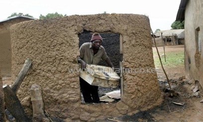 Monday Longshak in his burnt mud house at Sabon Gida in Quanpan district on May 21, 2004 after a raid by Fulani herdsmen/AFP