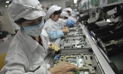 Workers asemble electronics products in Shenzhen, China, pictured May 27, 2010. Two Taiwanese electronics firms have received orders to make the iWatch, according to reports/AFP