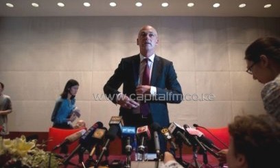 Theo Spierings (C), CEO of New Zealand dairy giant Fonterra, at a press conference in Beijing on August 5, 2013/AFP