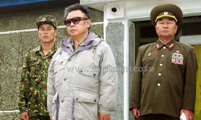 Korean People's Army (KPA) General Kim Kyok Sik (R) stands next to the late North Korean leader Kim Jong Il in 2007/AFP