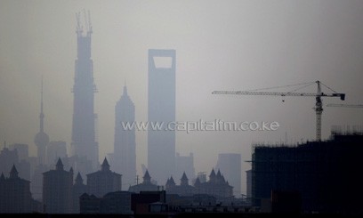 A view of Shanghai’s skyscrapers Oriental Pearl Tower (left), Shanghai Tower (under construction), Jin Mao Tower (2nd right) and the Shanghai World Financial Centre (right) are seen during a hazy day in the Shanghai financial district in this May 12, 2013/ AFP