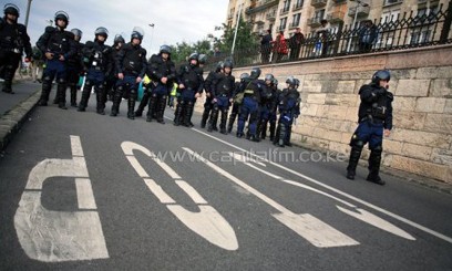 Police guard the route of a Hungarian Roma march to protest against ultra-right-wing nationalists in Budapest on September 20, 2008. Four Hungarian men were found guilty Tuesday of killing six Roma including a five-year-old child in a wave of brutal racially-motivated attacks between 2008 and 2009.