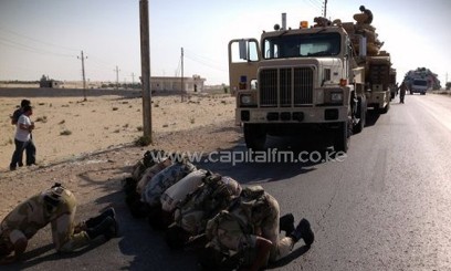 File picture taken on July 16, 2013 shows Egyptian soldiers praying in the northern Sinai town of Al-Arish/AFP