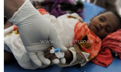 A girl is tended to by a doctor in Mogadishu on August 16, 2011/AFP