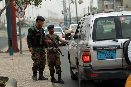 Yemeni soldiers control vehicles near Sanaa International Airport on August 6, 2013 in Yemen/AFP