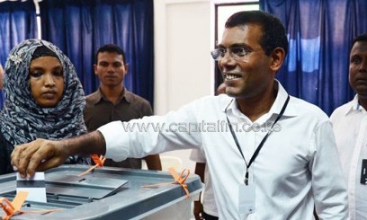 Former Maldives president Mohamed Nasheed smiles as he casts his vote at a local polling station in Male, on September 7, 2013/AFP