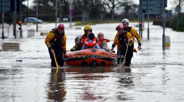 File picture shows an elderly British couple being rescued by a team from the Royal National Lifeboat Institute/AFP