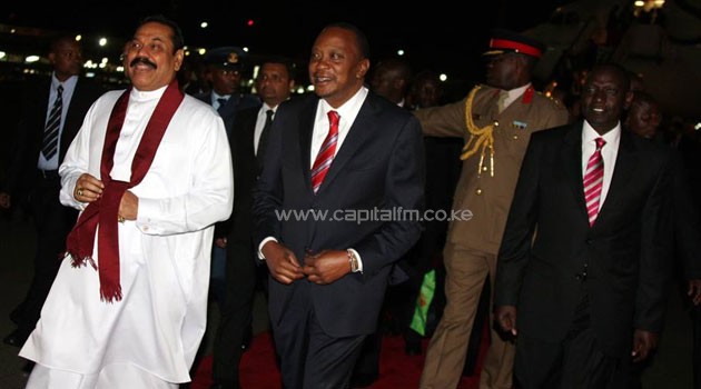 President Kenyatta receiving the Sri Lanka President Mahinda Rajapaksa on his arrival at JKIA to join Kenyans in celebrating Kenya@50