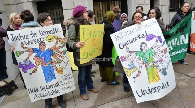 A group supporting domestic workers' rights demonstrate across the street from the Indian Consulate General in New York on December 20, 2013/AFP