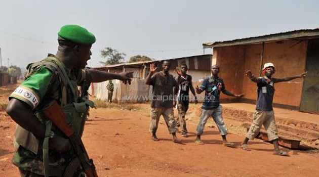A Rwandan soldier from the African-led International Support Mission to the Central African Republic (MISCA), gestures as he patrols in the Pk 13 district, north of Bangui on January 22, 2014/AFP