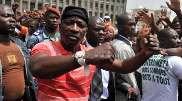 Charles Ble Goude , Ivory Coast's Minister of youth and employment and leader of the "young patriots", greets crowds on February 5, 2011 in Abidjan/AFP