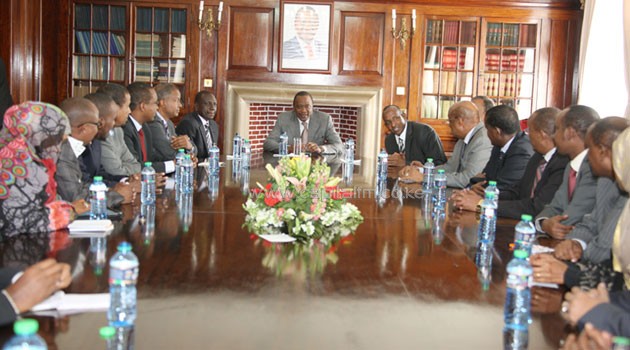 President Uhuru with MPs from the Somali community at State House Nairobi. Photo/PSCU