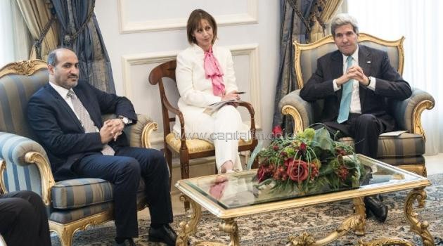 US Secretary of State John Kerry (R) and then leader of the Western and Saudi-backed Syrian National Coalition Ahmad Jarba (L) meet on June 27, 2014 at King Abdulaziz International Airport in the Saudi city of Jeddah/AFP