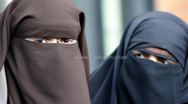 In France, a woman who repeatedly insists on appearing veiled in public can be fined 150 euros and ordered to attend re-education classes/AFP