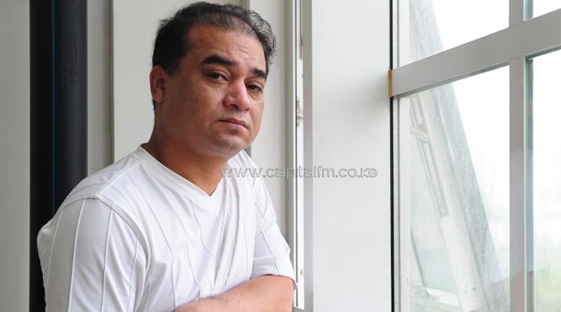 University professor Ilham Tohti pauses before a classroom lecture in Beijing on June, 2010. He has been sentenced to life in prison/AFP