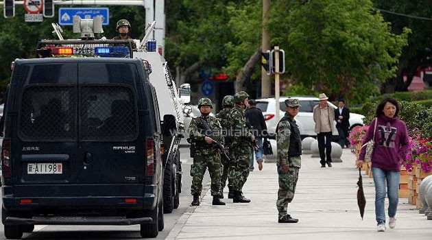 Chinese paramilitary police stand guard in Urumqi -- the capital of the Muslim Uighur region of Xinjiang