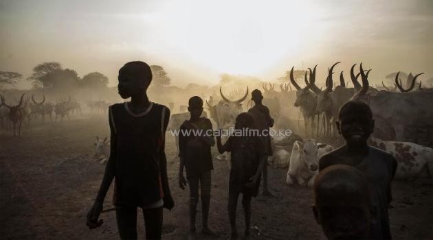 South Sudanese children from the Dinka ethnic group pose at cattle camp in the town of Yirol, in central South Sudan on February 12, 2014/AFP