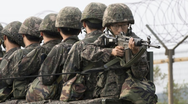 South Korean soldiers ride a military truck on the road leading to the truce village of Panmunjom in the border city of Paju on August 24, 2015 /AFP