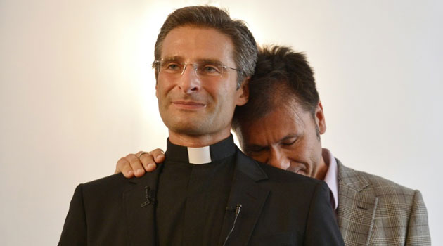 Polish priest Krzystof Charamsa's, pictured (L) with his partner. Photo/ AFP