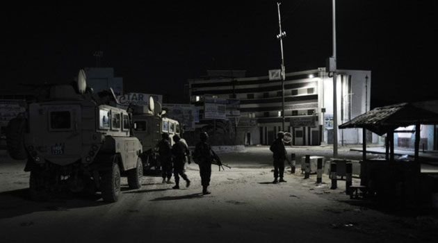 File picture shows soldiers from the African Union Mission in Somalia standing guard at the K4 roundabout in Mogadishu © AU UN IST/AFP