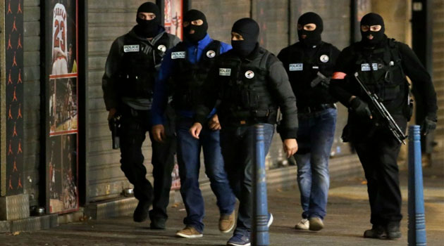 The police raid in the Paris suburb of Saint-Denis came as Europe was placed on high alert after footage from the scene of one of Friday's attacks revealed a ninth suspect may have taken part © AFP
