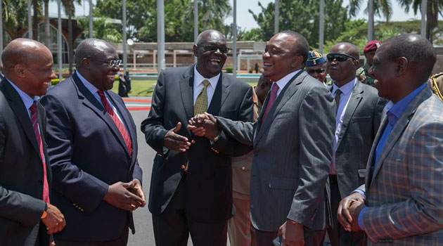 President Uhuru Kenyatta chats with Nairobi politician Fred Gumo at JKIA shortly before he left for 3-day State visit to Israel/PSCU