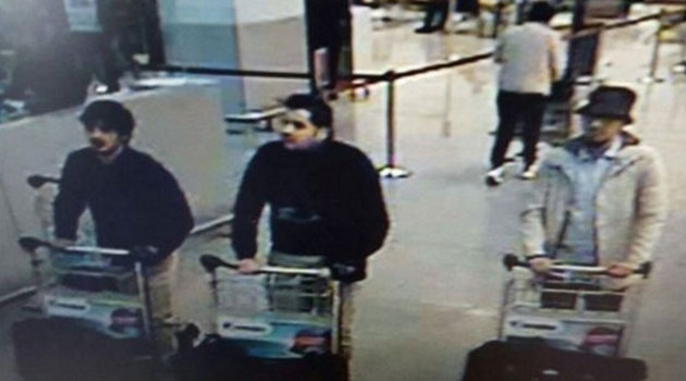 Two have dark hair and one is wearing a hat/AFP