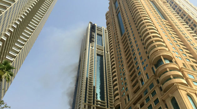 Flames and smoke billow from the Sulafa tower in Dubai Marina A on July 20, 2016 after a fire engulfed several floors of the 75-storey apartment block/AFP
