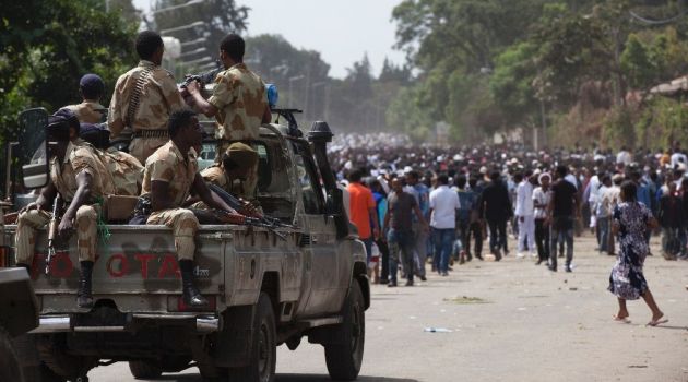 Oromo regional police officers patrol in pick-up truck during the Oromo new year holiday of Irreechaa in Bishoftu, southeast of Ethiopia's capital Addis Ababa, on October 2, 2016/AFP