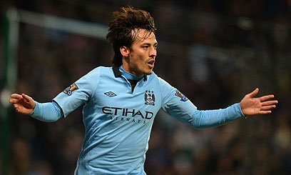 Manchester City's midfielder David Silva celebrates after scoring the second goal during their English Premier League football match against Fulham at The Etihad stadium- AFP