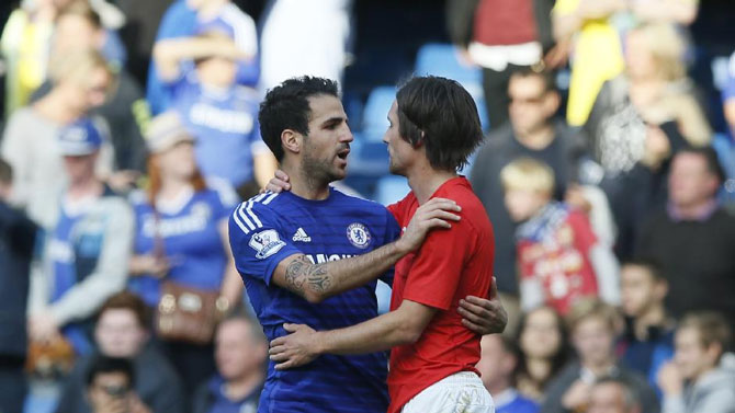 Tomas Rosicky (right) and former teammate, Cesc Fabregas embrace after Arsenal and Chelsea played to a 0-0 at the Emirates. PHOTO/File