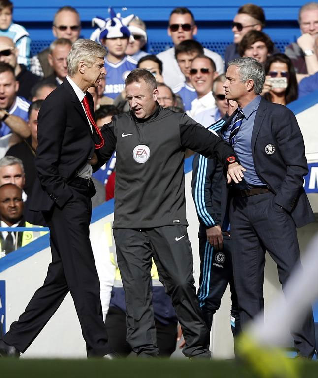 Arsene Wenger (left) and Jose Mourinho clash at their EPL match at Stamford Bridge last season. PHOTO/File