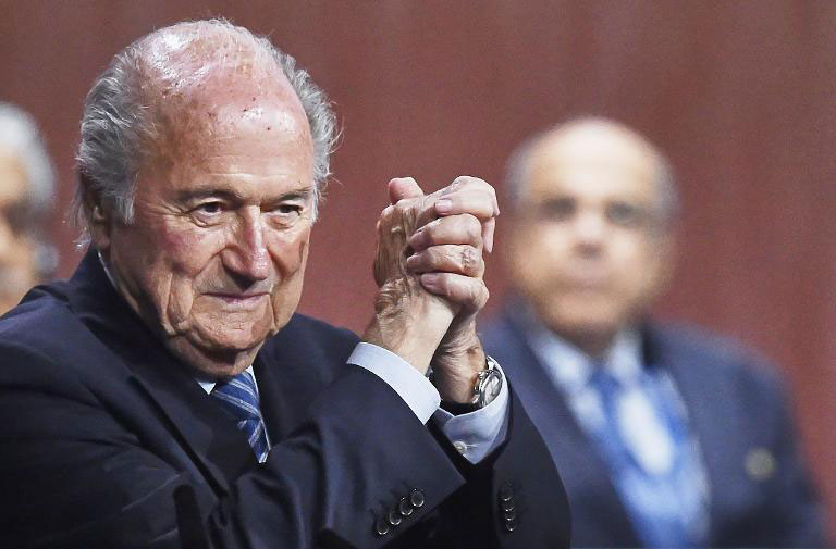 FIFA President Sepp Blatter celebrates after being re-elected following a vote to decide on the FIFA presidency in Zurich on May 29, 2015 .