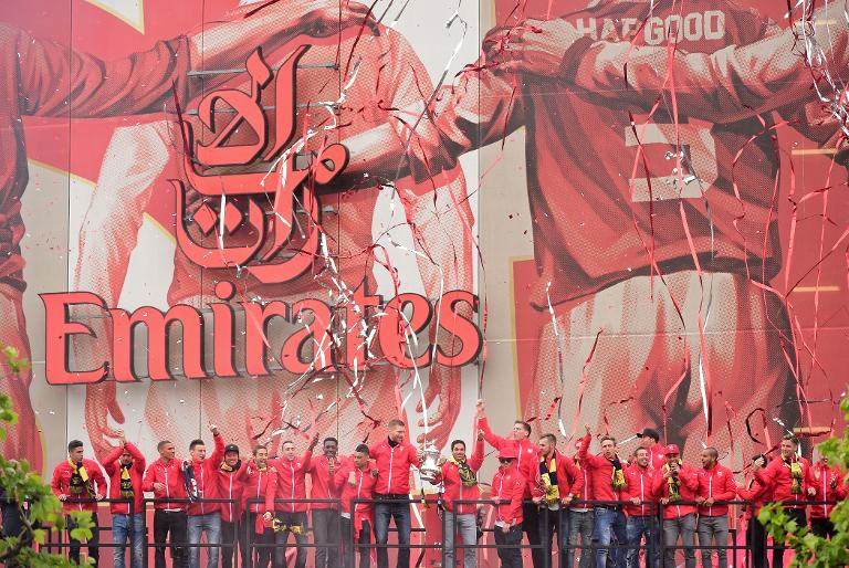 Arsenal FC celebrate their FA Cup win. English Premier League clubs generated record combined revenues of £3.26 billion ($5 billion, 4.4 billion euros) in 2013-14, according to a report published by business advisory firm Deloitte