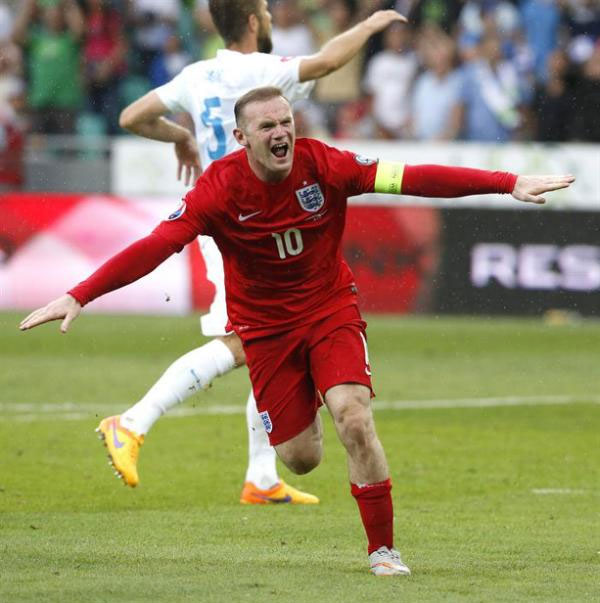 England's Wayne Rooney celebrates scoring against Slovenia during the UEFA EURO 2016 qualification soccer match between Slovenia and England in Ljubljana, Slovenia. PHOTO/AFP