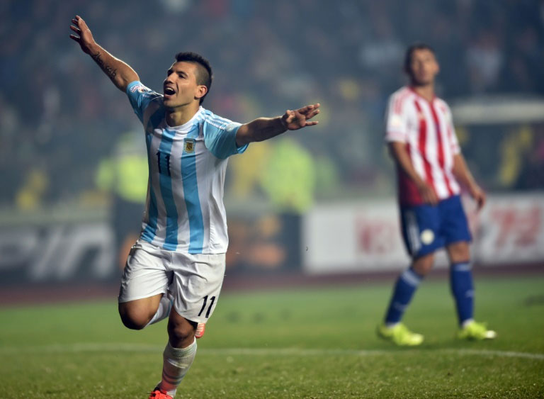 Argentina's Sergio Aguero (L) celebrates after scoring a goal against Paraguay, during their Copa America semi-final match in Concepcion, Chile. PHOTO/AFP