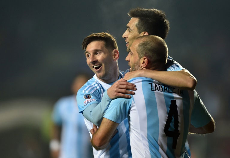 Argentina's Javier Pastore (C) celebrates with teammates Lionel Messi (L) and Pablo Zabaleta after scoring against Paraguay during their Copa America semi-final match in Concepcion, Chile. PHOTO/AFP