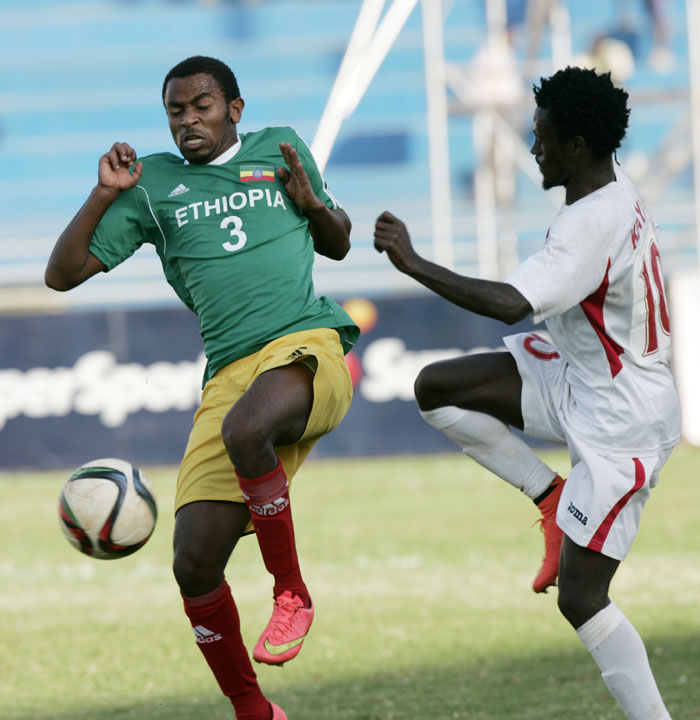 Kenya's Kevin Kimani (r) vies for the ball against Ethiopia's Zakarias Tuji during their CHAN clash at Nyayo. PHOTO/Raymond Makhaya