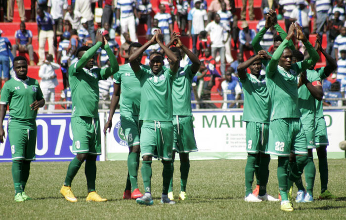 Gor Mahia players applaud their supporters after the match was called off. PHOTO/Raymond Makhaya