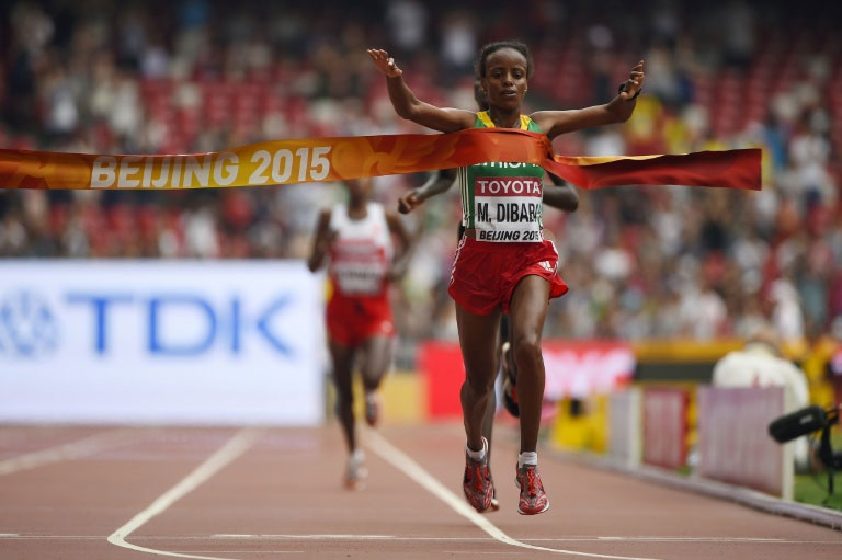 Ethiopia's Mare Dibaba wins the final of the women's marathon athletics event at the 2015 IAAF World Championships at the "Bird's Nest" National Stadium in Beijing on August 30, 2015. PHOTO/AFP
