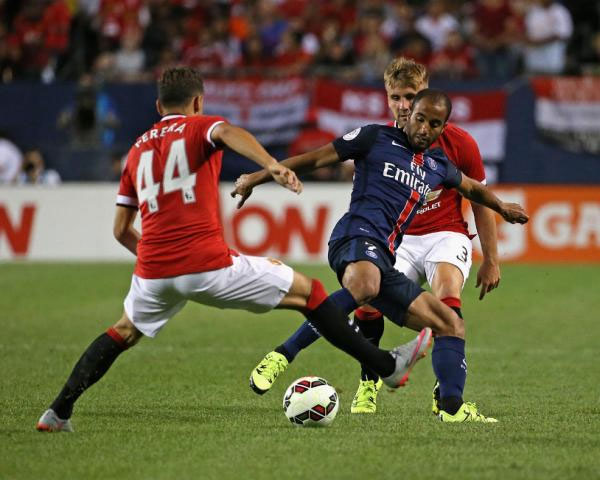Lucas Moura #7 of Paris Saint-Germain controls the ball between Andreas Pereira #44 and Luke Shaw #3 of Manchester United during a match in the 2015 International Champions Cup at Soldier Field on July 29, 2015 in Chicago, Illinois. Paris Saint-Germain defeated Manchester United 2-0. PHOTO/Yahoo! Sports