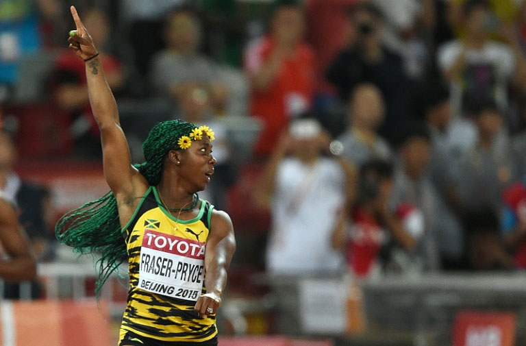 Jamaica's Shelly-Ann Fraser-Pryce celebrates winning the women's 100m final at the 2015 world championships in Beijing. PHOTO/AFP