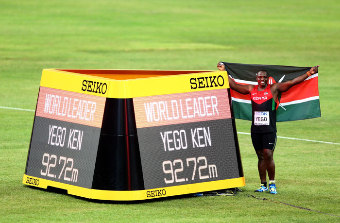 Julius Yego stands next to the plaque declaring him the world leader after his monster 92.72m throw won him the men Javelin title in Beijing on August 26, 2015. PHOTO/IAAF/Getty Images